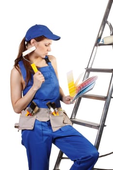 Female construction worker with palette in hands on a white background