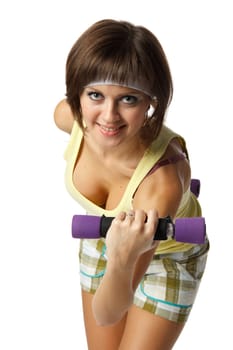 The beautiful sports girl with dumbbells on a white background. Training.