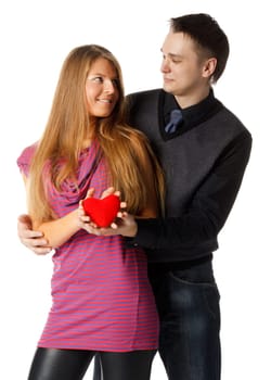 Young enamoured couple with a heart on a white background.
