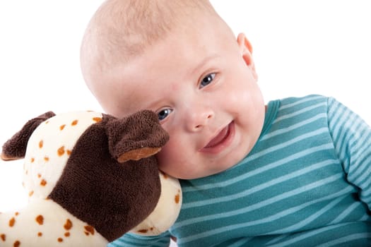 The nice small child in striped rompers with toy on a white background.