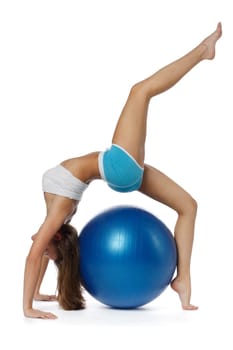 Young  beautiful woman with gymnastic ball on a white background.