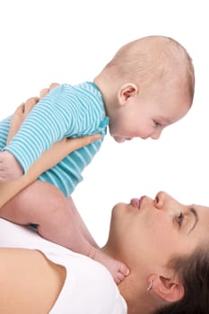 Happy mum plays with the small child a white background.