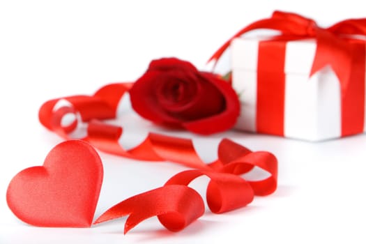 Gift box and rose on a white background. Valentine&#039 s day card.
