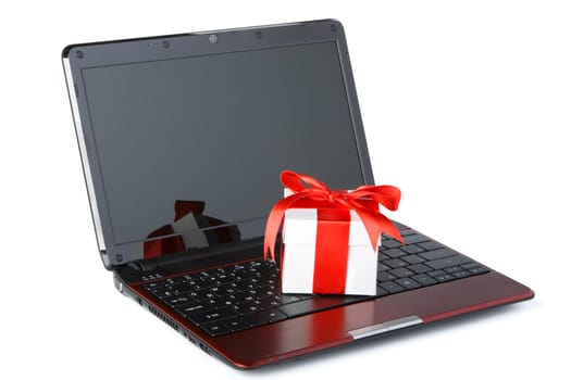 Modern notebook ang gift box on a white background