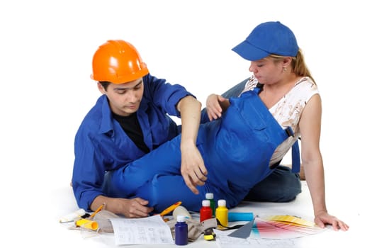 The pregnant woman together with the husband plan an interior of a children&#039 s room