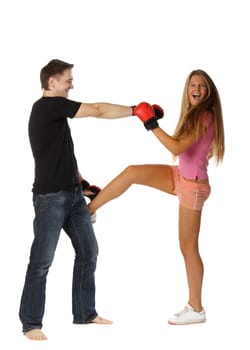 Sporty couple in red fighting gloves on a white background.