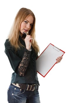 The beautiful girl stands with a clipboard and the pen in hands on a white background.