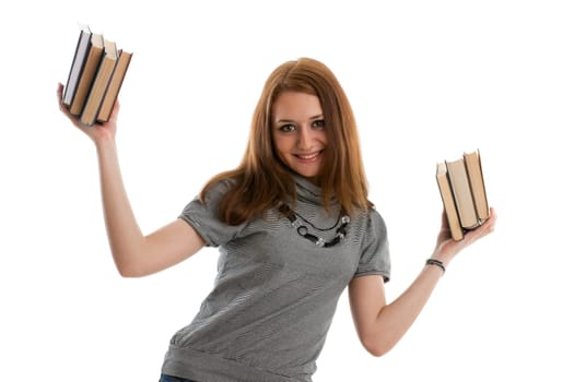 The attractive student stands with books on a white background. The student.