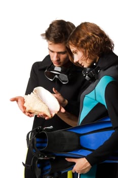 Young happy people with diving suits with a seashell on a white background.