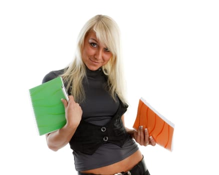 The beautiful girl stand with coloured writing-books on a white background. The student.
