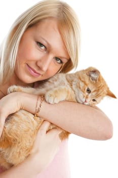 The happy young woman with a small amusing kitten on a white background.