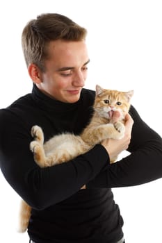 Young man with a small kitten on a white background.