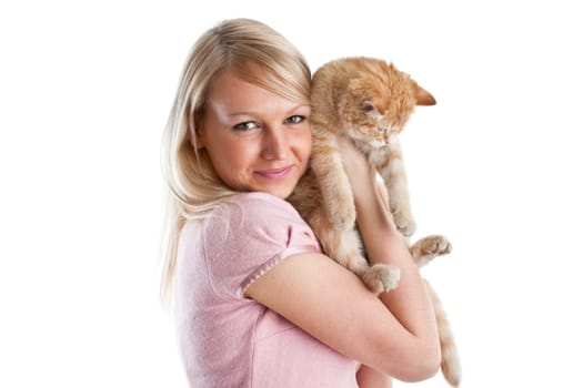 The happy young woman with a small amusing kitten on a white background.