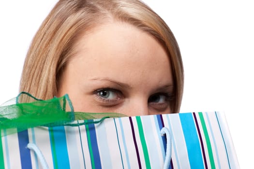 Pretty woman with shopping bag on a white background