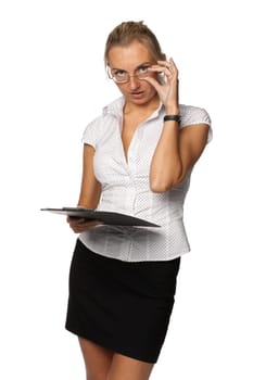 The beautiful blonde stands with a clipboard in hands on a white background.