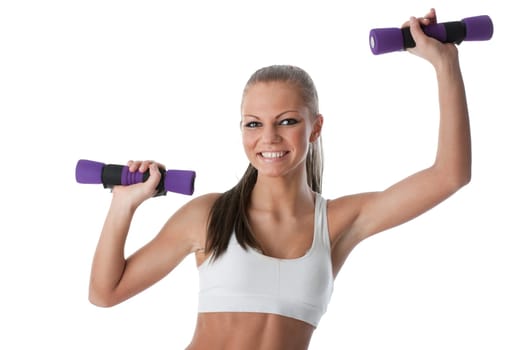 The beautiful sports girl with dumbbells on a white background. Training.