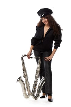 Sexy girl in a uniform of the security guard with a saxophone on a white ackground