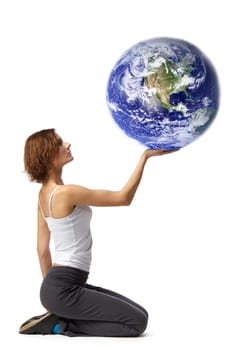 Young beautiful woman with globe on a white background.