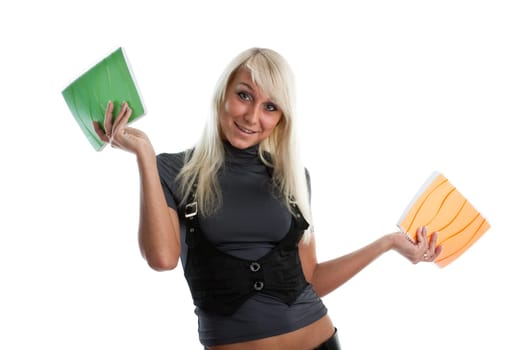 The beautiful girl stand with coloured writing-books on a white background. The student.