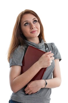 The attractive student stands with the laptop on a white background.