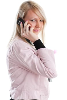 The beautiful girl stand with writing-books and mobile phone on a white background. The student.