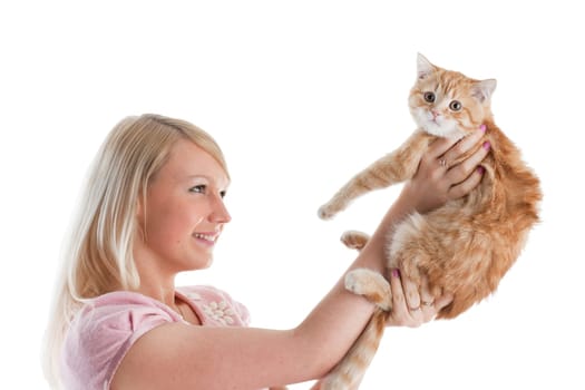 The happy young woman with a small amusing kitten on a white background.