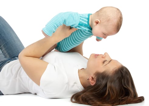 Happy mum plays with the small child a white background.