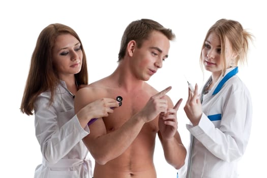 Two nurses and the young male patient on a white background.