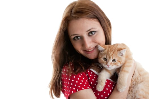 The happy young woman with a small amusing kitten on a white background.