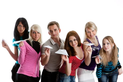 Group of young happy people with paper planes on a white background.