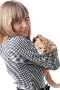 The happy young woman with a small amusing kitten on a white background.