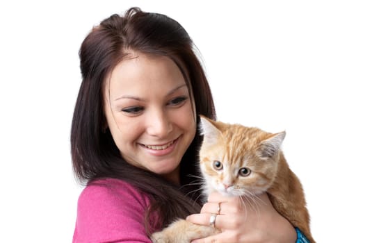 The happy young woman with a small amusing kitten on a white background.