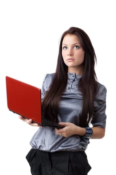 The attractive student stands with the laptop on a white background.