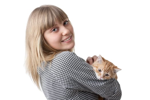 The happy young woman with a small amusing kitten on a white background.