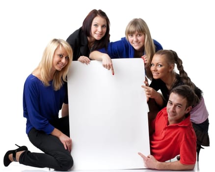 The group of young people holds the empty board for the text on a white background.