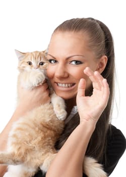 The happy young woman with a small amusing kitten on a white background.