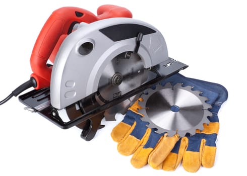 Handheld circular saw and protective clothes on a white background