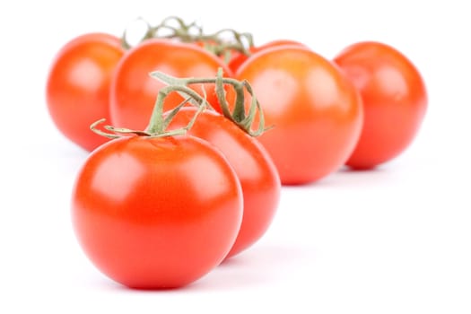 Fresh appetizing tomatoes on a white background. Close up.