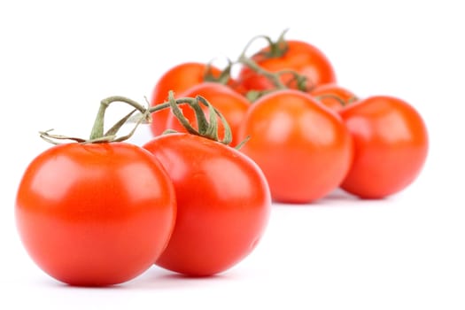 Fresh appetizing tomatoes on a white background. Close up.