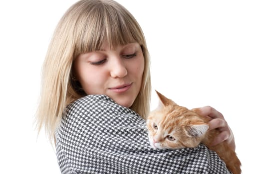 The happy young woman with a small amusing kitten on a white background.