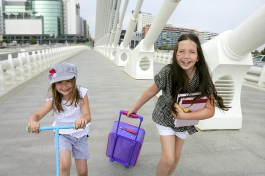 Little girls going to school with bags, books and student stuff