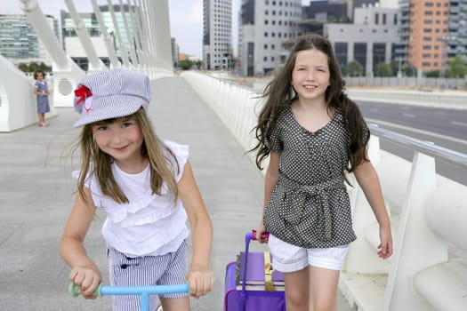 Little girls going to school with bags, books and student stuff