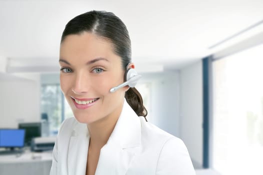 Headset phone business woman dress in white indoor modern office