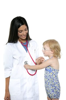 Brunette pediatric doctor with blond little girl on medical exam