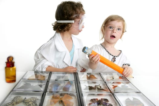 Naturalist little girls playing with big pencil and butterfly collection
