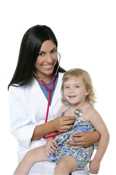 Brunette pediatric doctor with blond little girl on medical exam