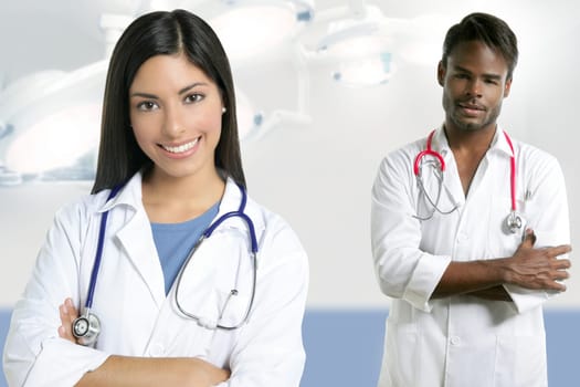 Couple of doctors asian indian woman and african man in the surgery hospital