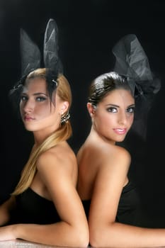 Beautiful fashion two women with veil over black