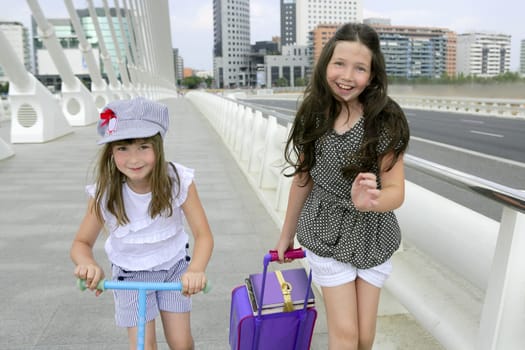 Little girls going to school with bags, books and student stuff