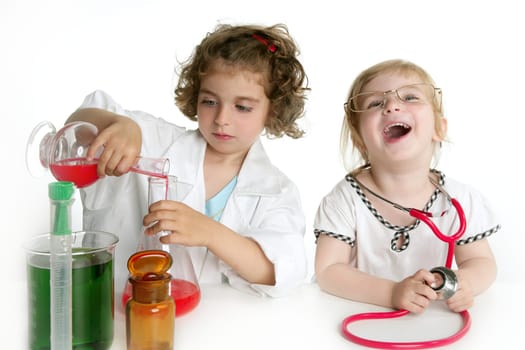 Two girls pretending to be doctor in the laboratory